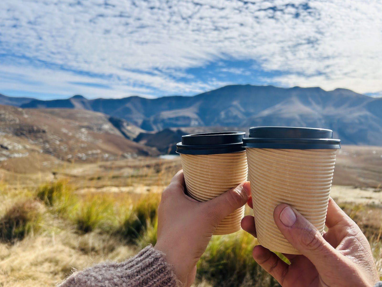 Takeaway coffees with mountain view