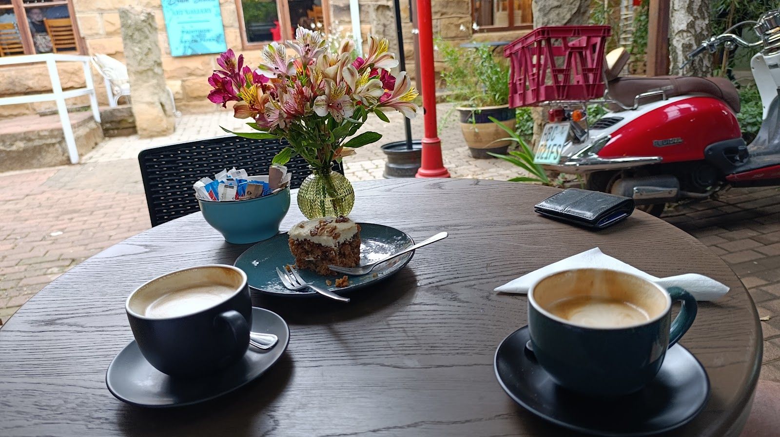 Cappuccinos and flowers outside